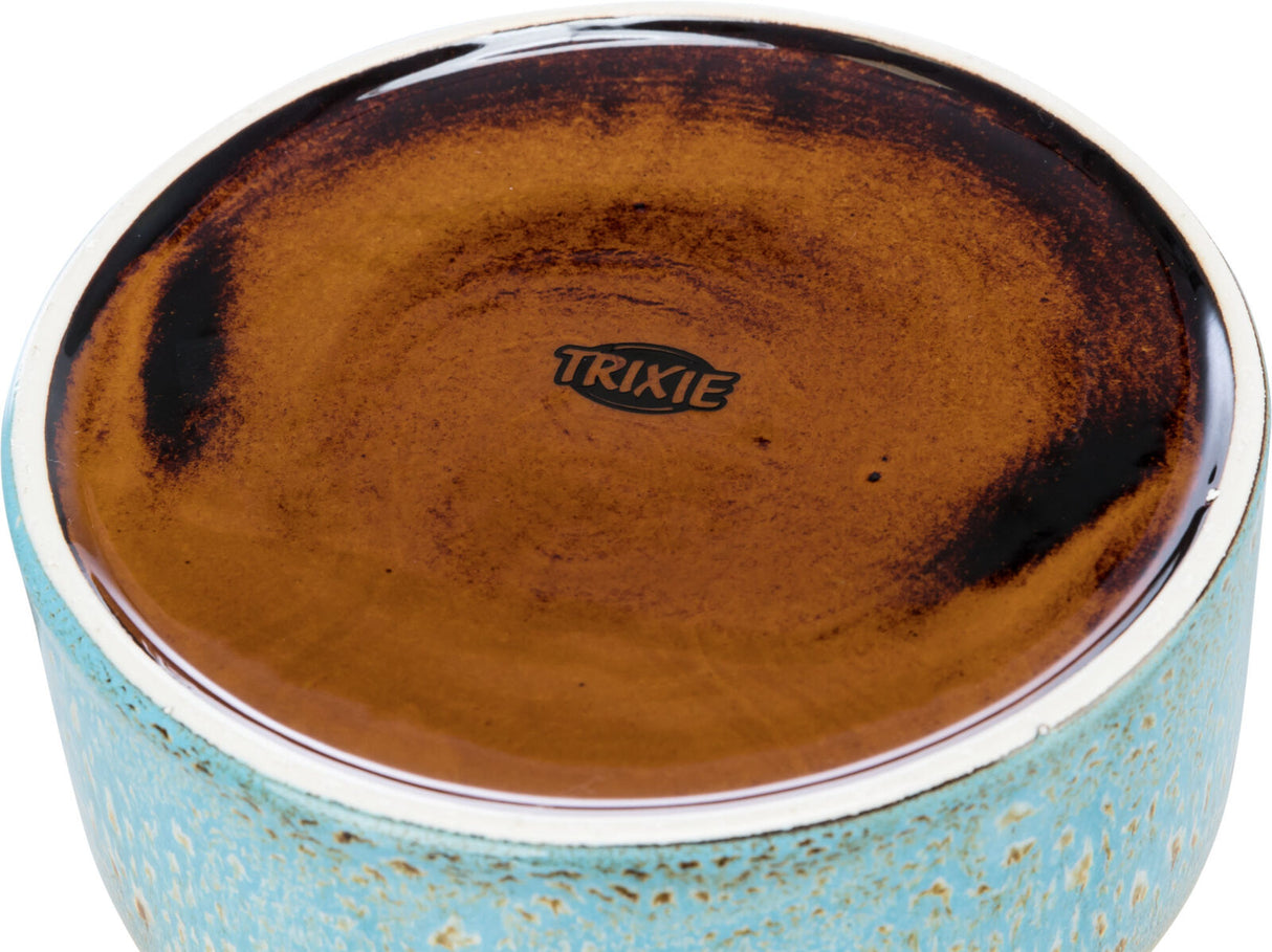 Keramikschale mit braunem Innenbereich und türkisem, gesprenkeltem Außenrand, Markenname "TRIXIE" sichtbar.