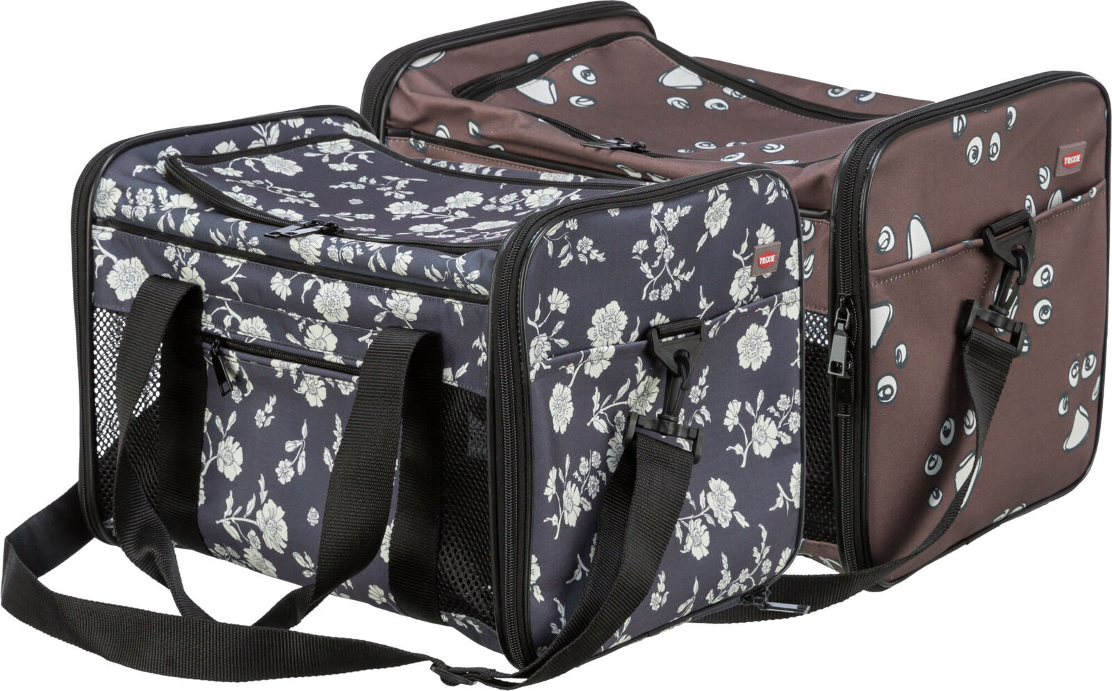 Transporttasche mit Blumenmuster und Gesichtsmotiven, schwarze Tragegriffe, mehrere Reißverschlüsse, Netzseitenteile.
