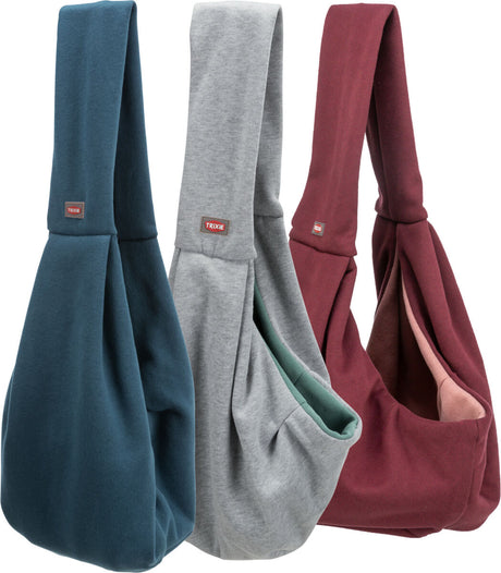 Drei Stofftragetaschen in Blau, Grau und Rot, jeweils mit „Trixie“-Etikett, zeigen eine weiche Oberfläche.