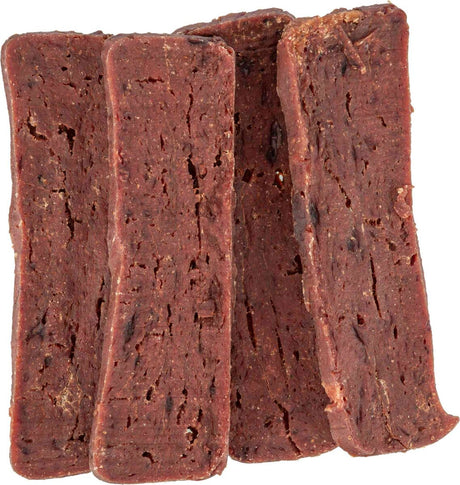 Vier braune, spröde Riegel mit unregelmäßiger Oberfläche liegen nebeneinander.