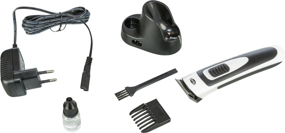 Haarschneidemaschine-Set mit Ladestation, Netzteil, Pflegemittel, Reinigungspinsel und Kammaufsatz.