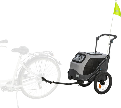 Fahrradanhänger mit zwei Rädern, grauem Gehäuse und gelber Fahne, zeigt Verbindung zu einem Fahrrad.