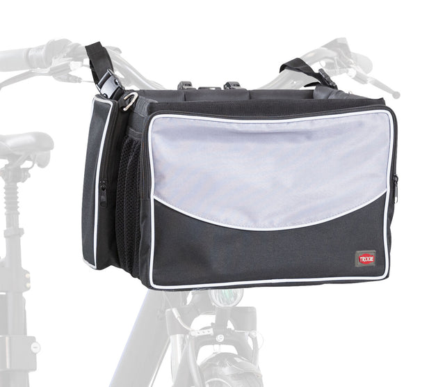 Schwarze Fahrradtasche mit grauer Frontklappe und Reißverschlusstaschen, hinten an Fahrrad befestigt.